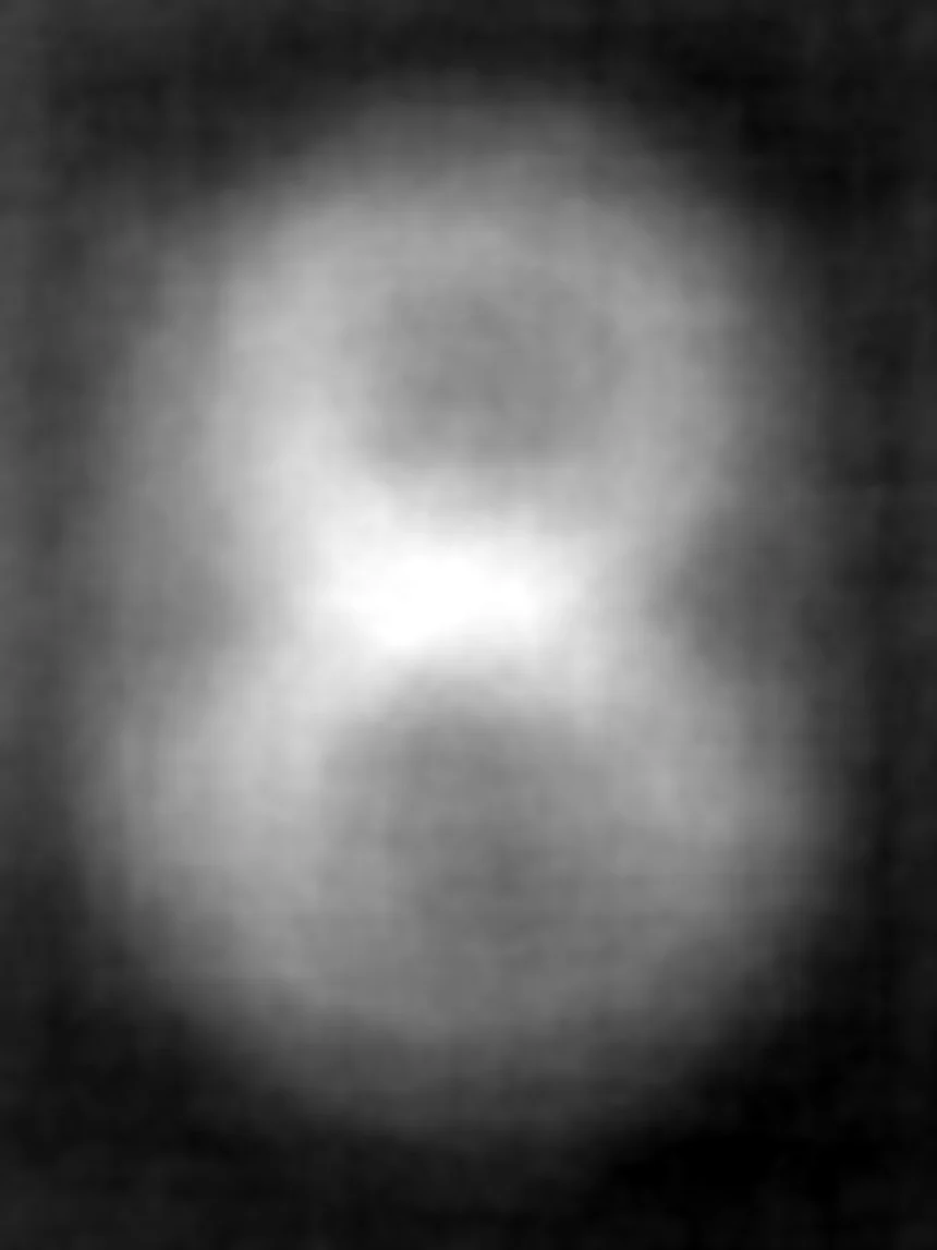 The per-pixel standard deviation across the collection: an unmistakable figure 8, bright against a dark ground